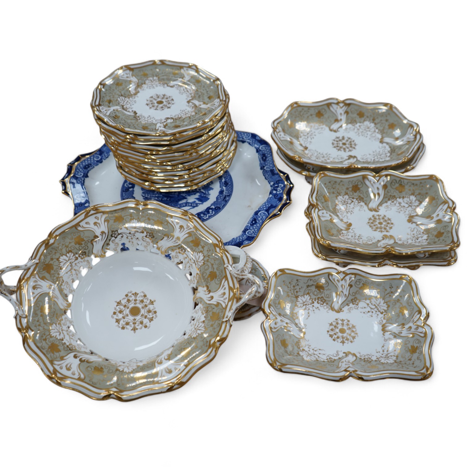 A Davenport part grey and gilt dessert service, together with a blue and white circular serving dish, dish 43cm wide. Condition - comport base broken